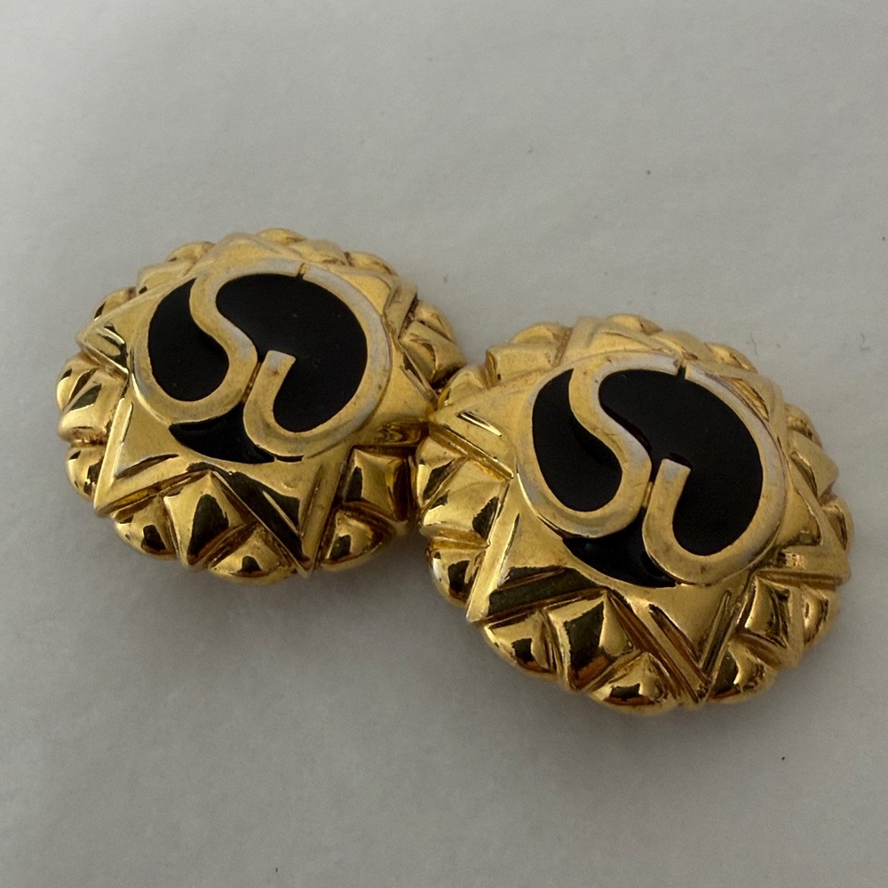 St. John gold with black enamel clip on earrings